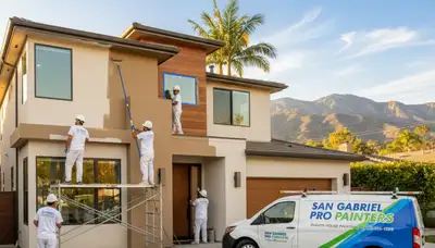 Professional house painters in Pasadena CA applying exterior paint to a residential home façade